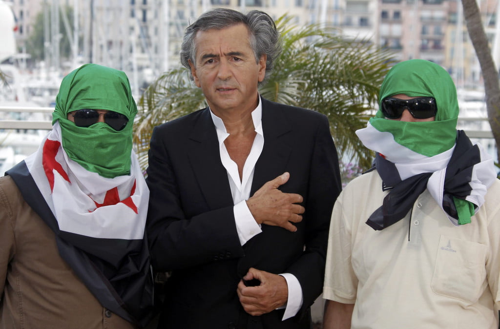 Director Bernard-Henry Levy (C) and two unidentified men pose during a photocall for the film "Le Serment de Tobrouk" at the 65th Cannes Film Festival, May 25, 2012. REUTERS/Jean-Paul Pelissier (FRANCE - Tags: ENTERTAINMENT)