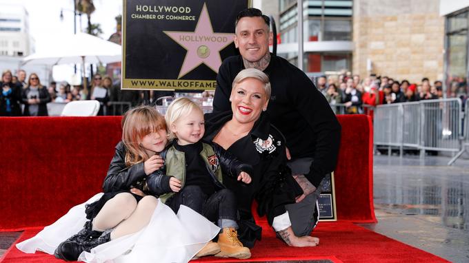 Singer and songwriter Pink poses for a picture with her husband Carey Hart and two kids Willow and Jameson as she receives a star on the Hollywood Walk of Fame in Los Angeles, California, U.S., February 5, 2019.    REUTERS/Mike Blake - RC116762B900